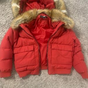 Red puffer coat great condition w/removable hood. Size 12 broken zipper
